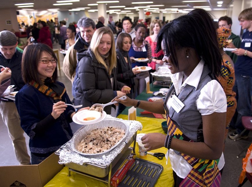 Community members trying various food at the interntional food fest.